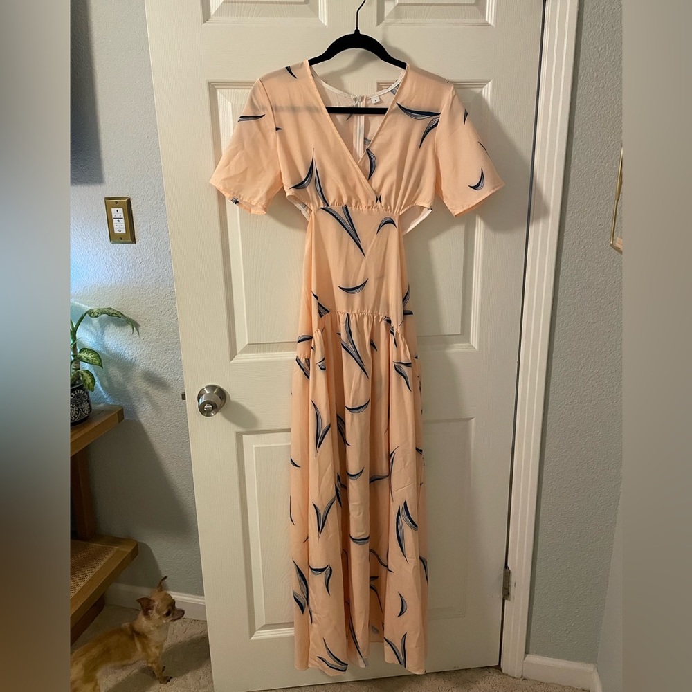 Peach colored maxi dress with side cutouts